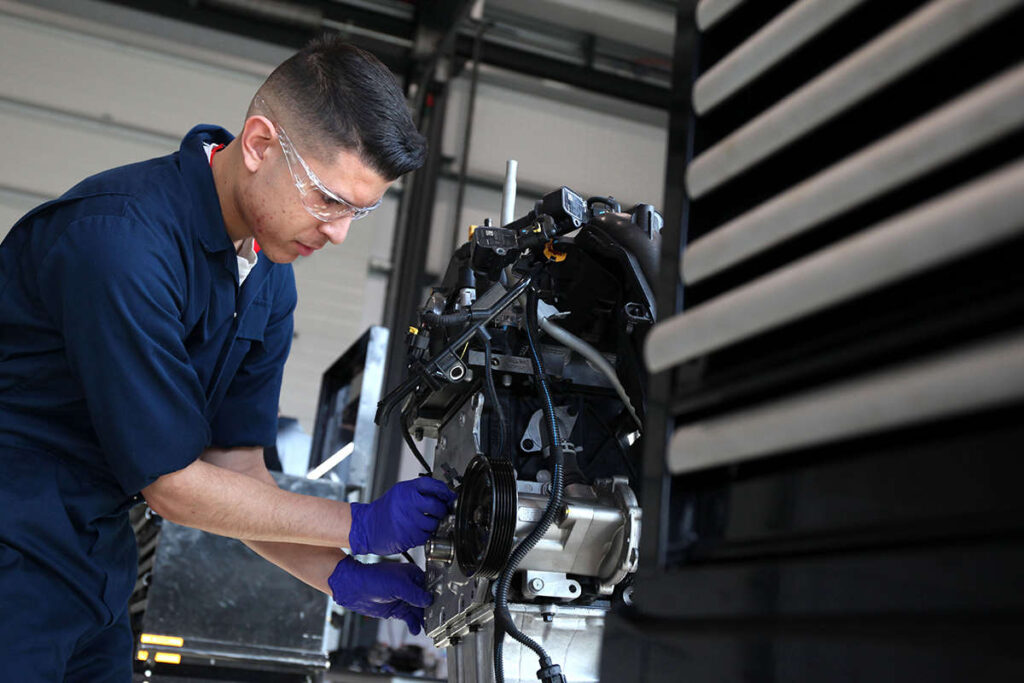 a student mechanic operating machinery