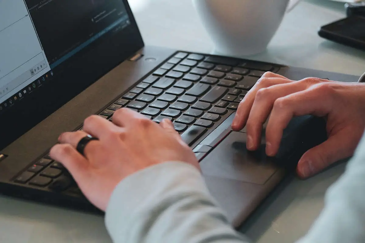 hands on a laptop keyboard