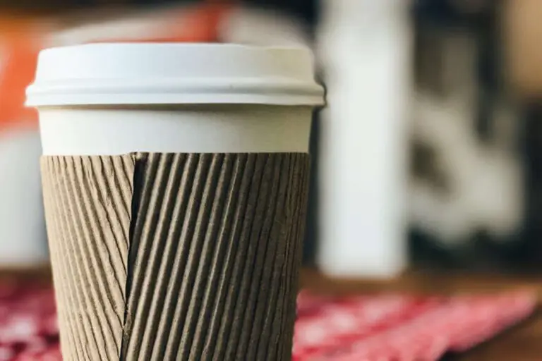The image shows a paper coffee cup