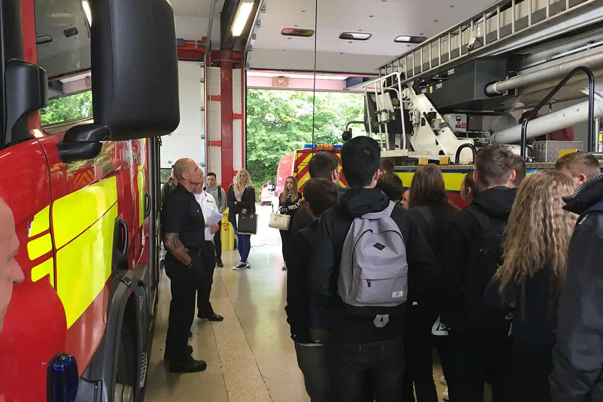 A group of students in a fire station