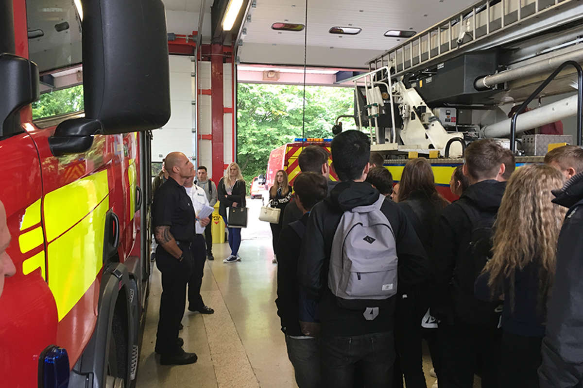 A group of students visiting a fire station