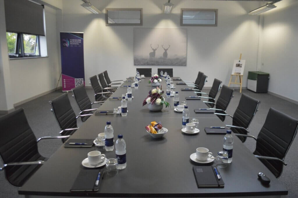 a conference table set up, ready for a meeting to begin