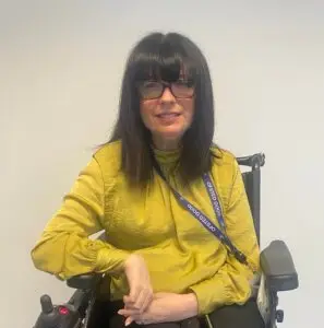 A staff member from Macclesfield College is smiling for a photo