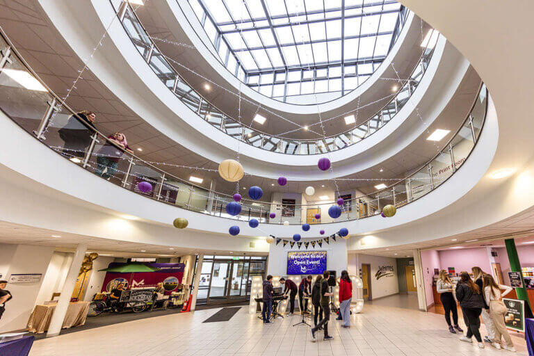 The College atrium decorated with balloons for an open event