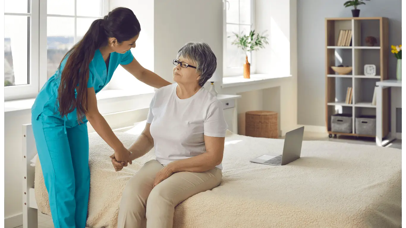 A health care assistant helping a patient in a care home