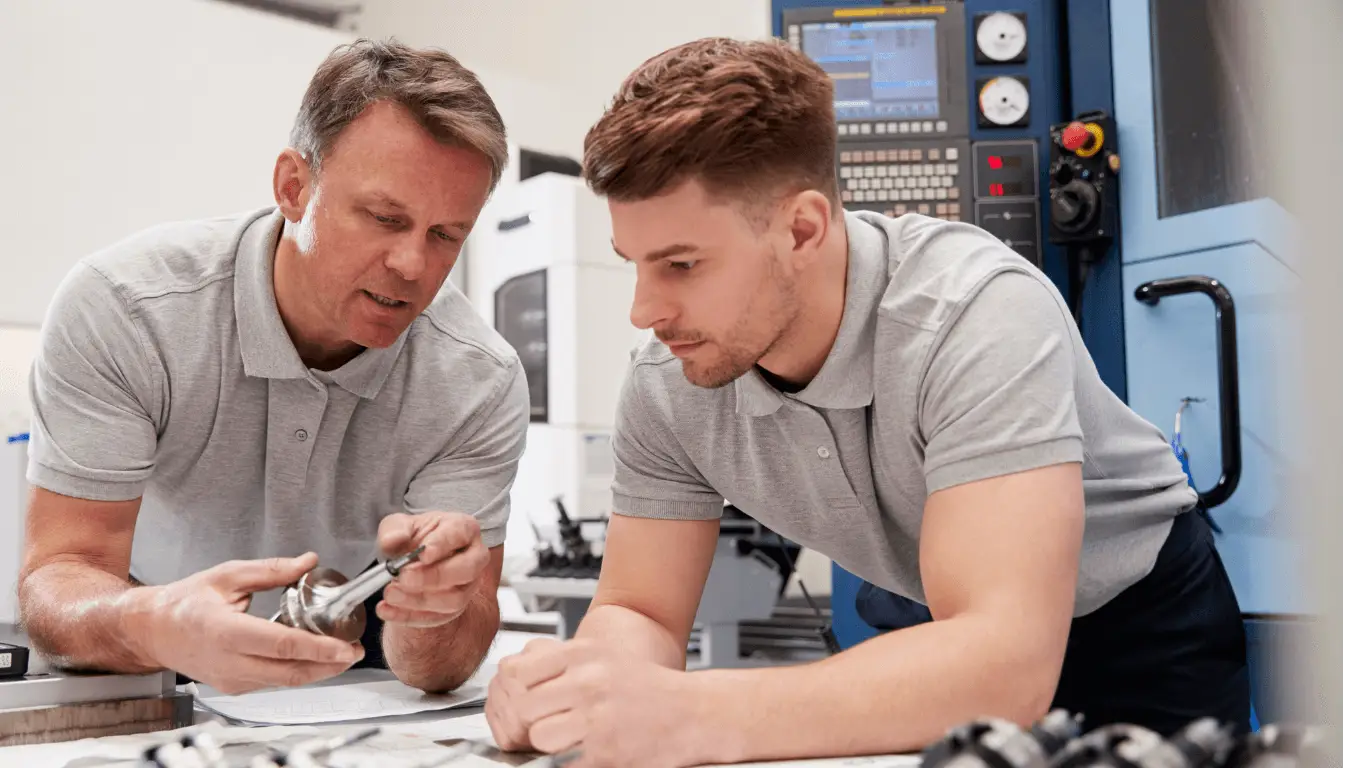 Two engineers chatting about machinery