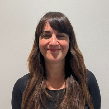 A headshot of a staff member smiling.