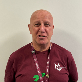 A headshot of a staff member smiling.