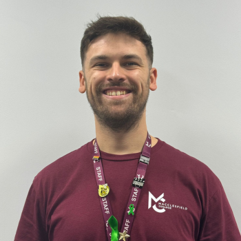 A headshot of a staff member smiling.