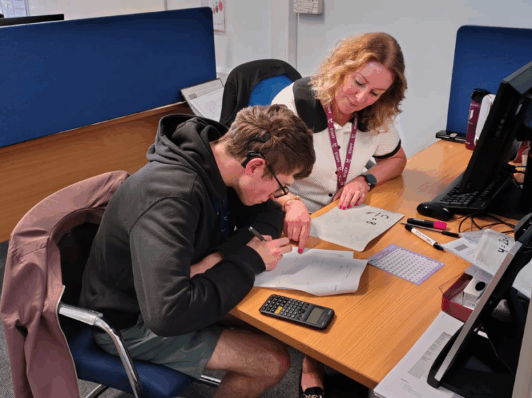 A member of the Study Centre team helping a student with their revision.