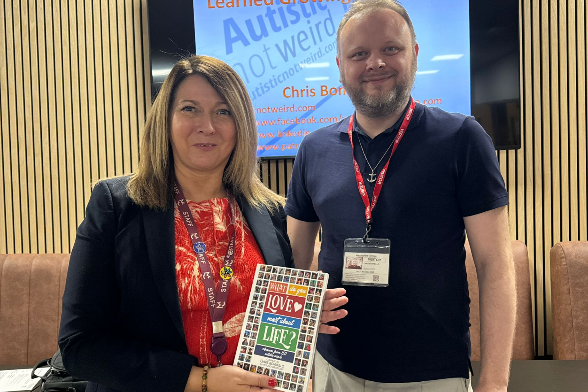 A staff member and guest speaker smiling for a photo