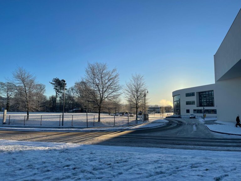 Macclesfield College field with a sunny snowy setting.