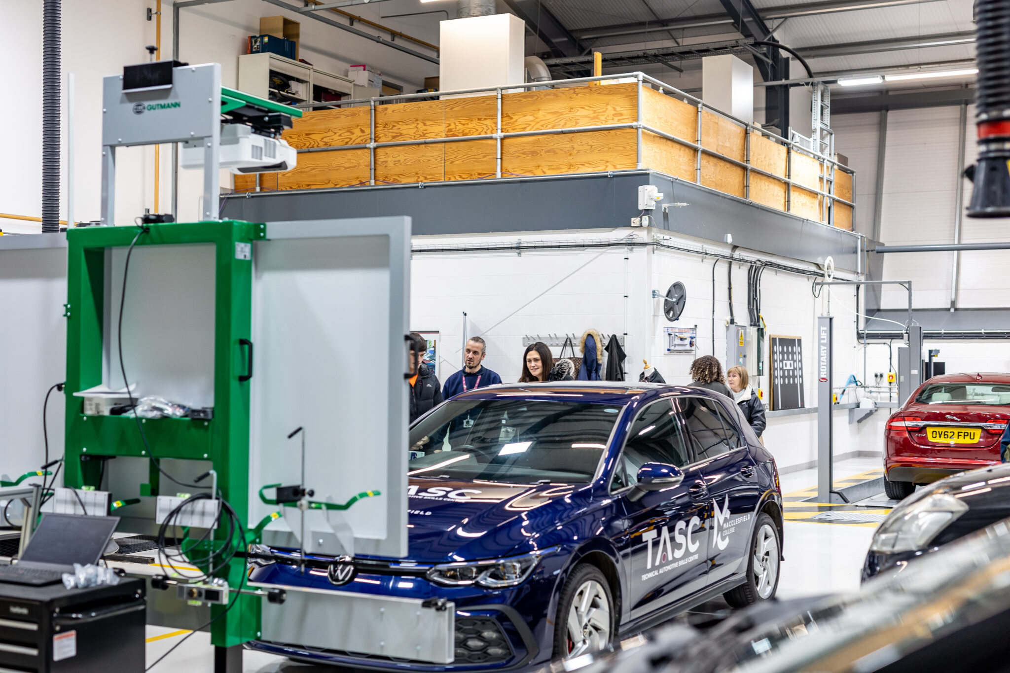 A photograph of Macclesfield College's Automotive workshop during an open event