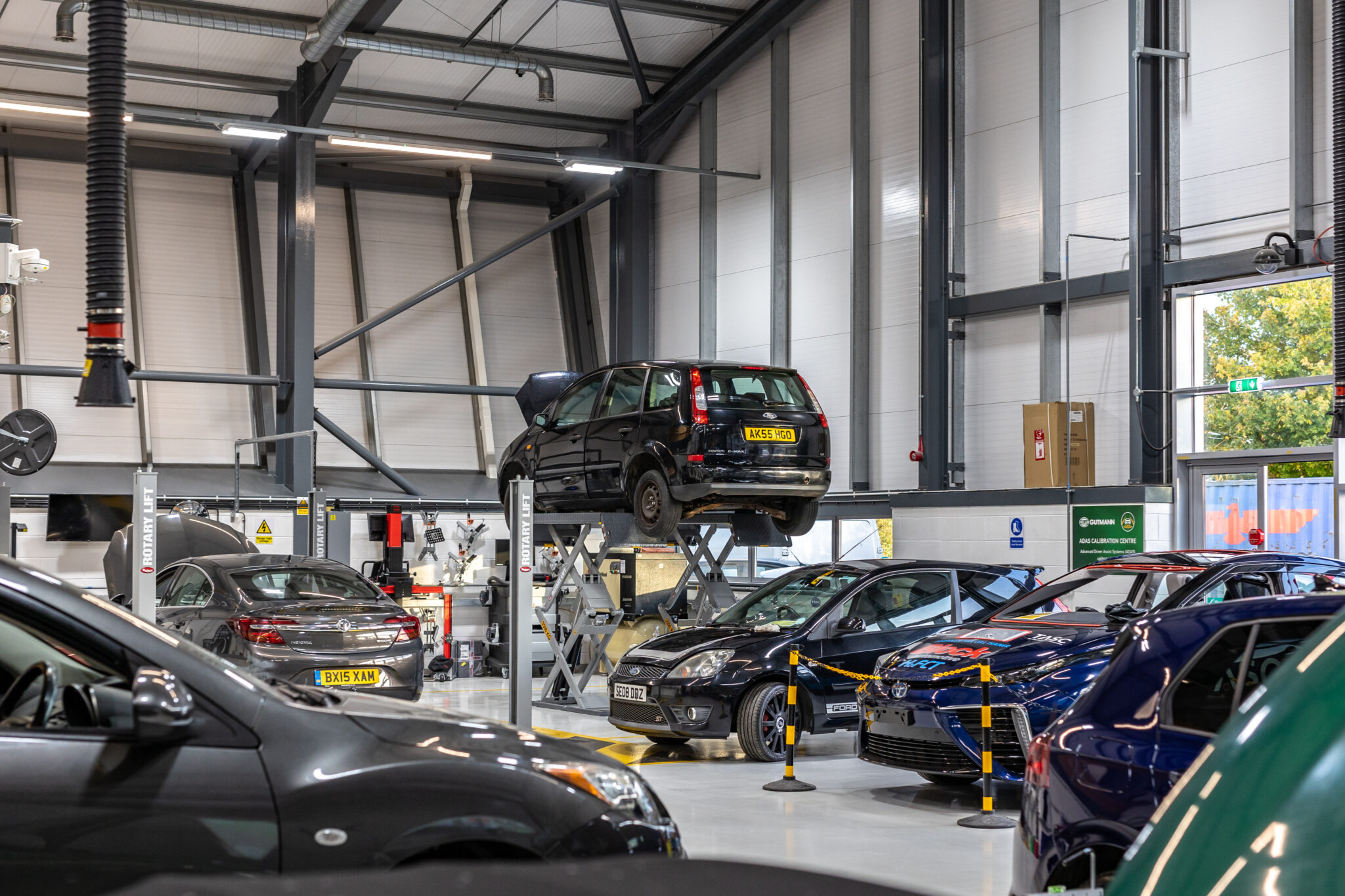 Cars inside Macclesfield College's Automotive workshop