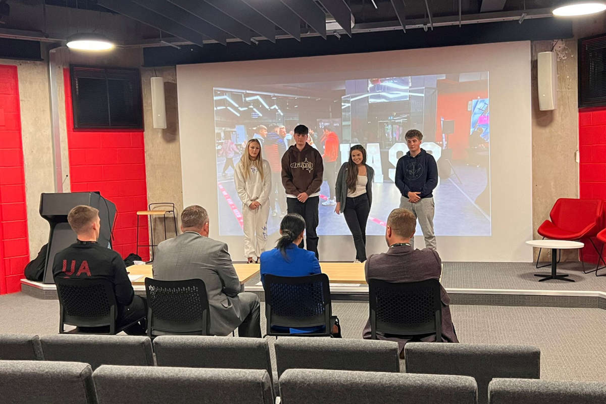 A group of students are presenting a mock presentation