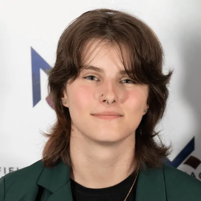 A student smiling for a headshot photo