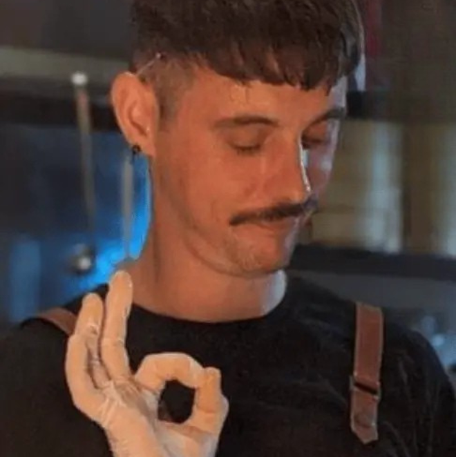 A headshot of a student smiling for a photo.