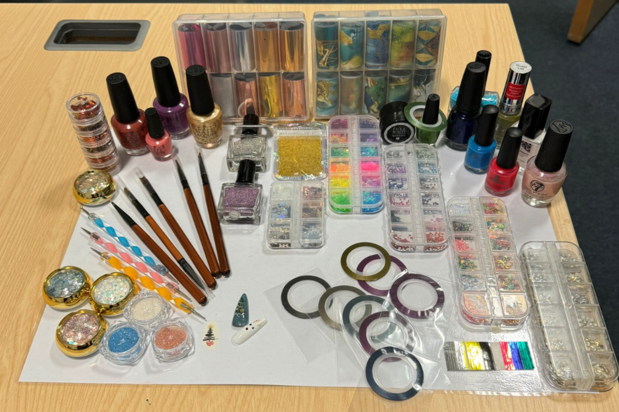 Nail art is set up nicely on a table