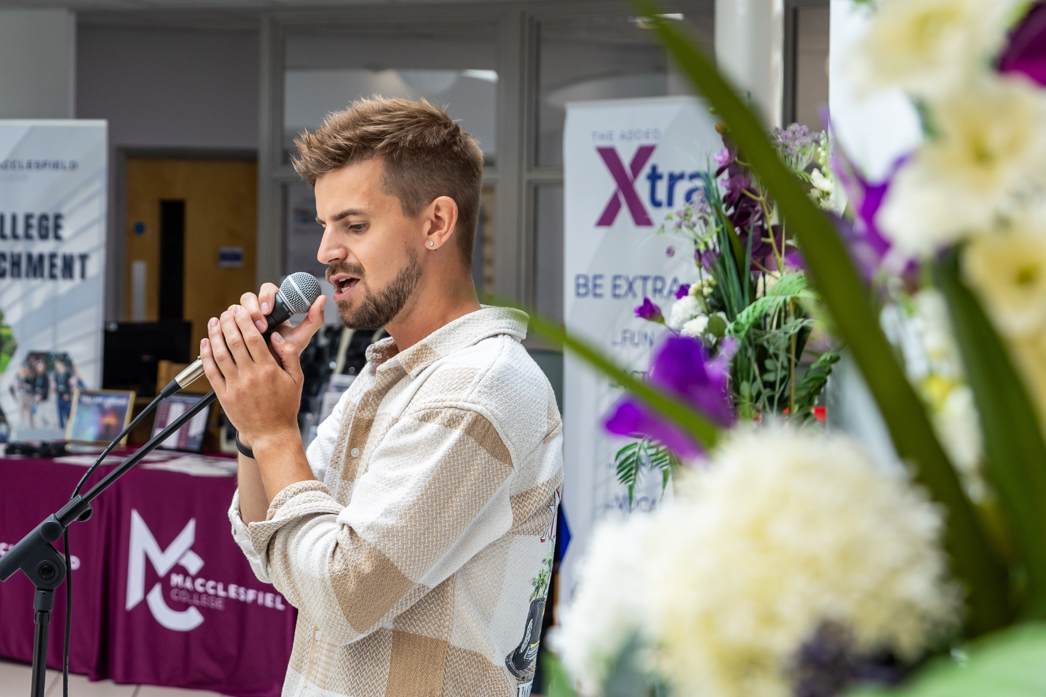 A singer is performing at Macclesfield College