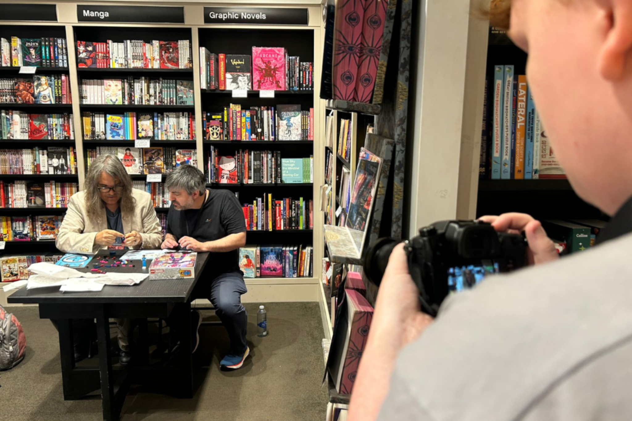 A Creative Media student is filming during Macc Pow convention.