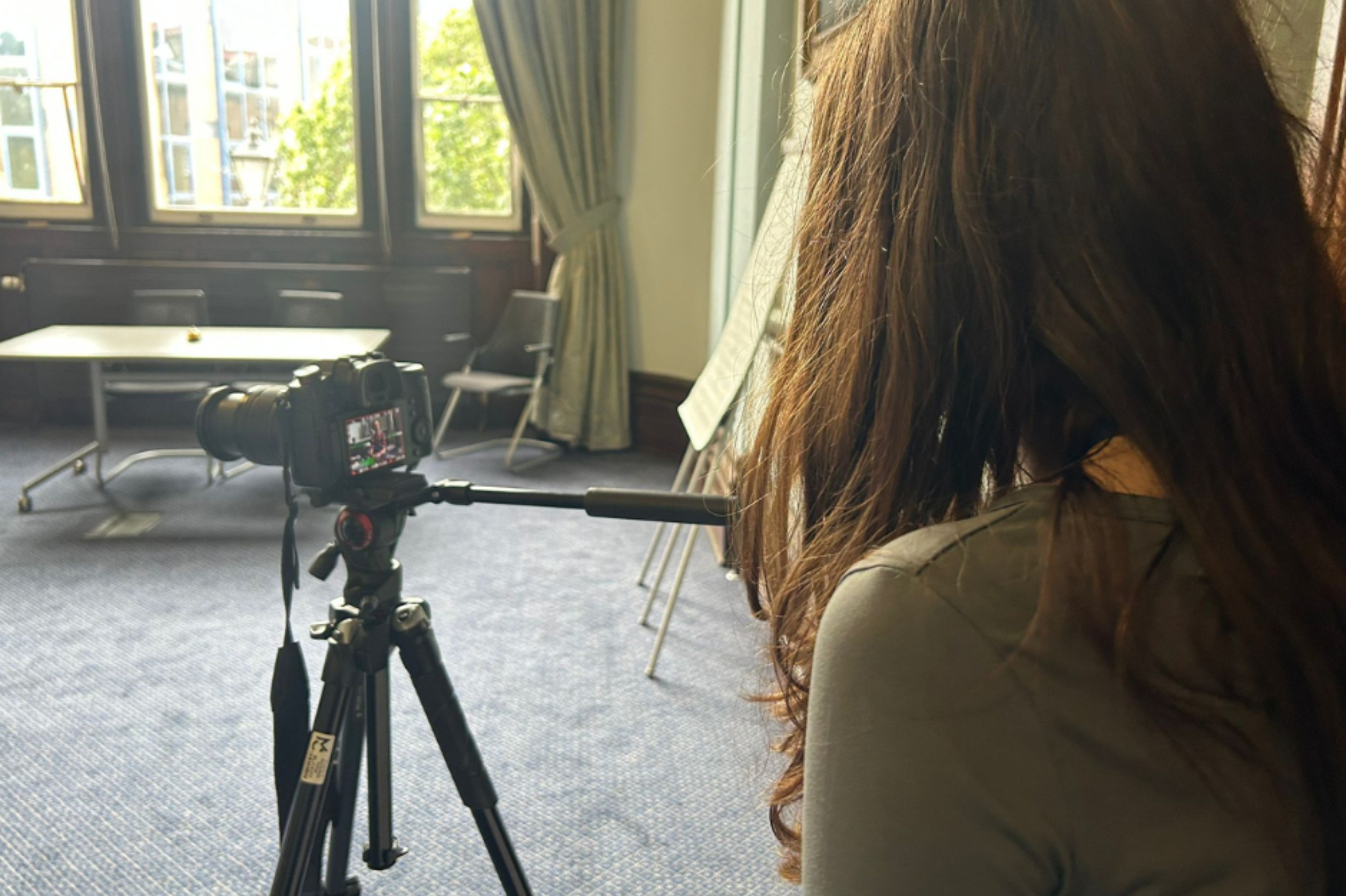 A Creative Media student is filming during Macc Pow convention.