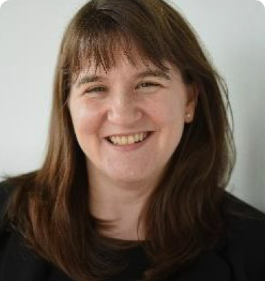 A headshot of woman smiling