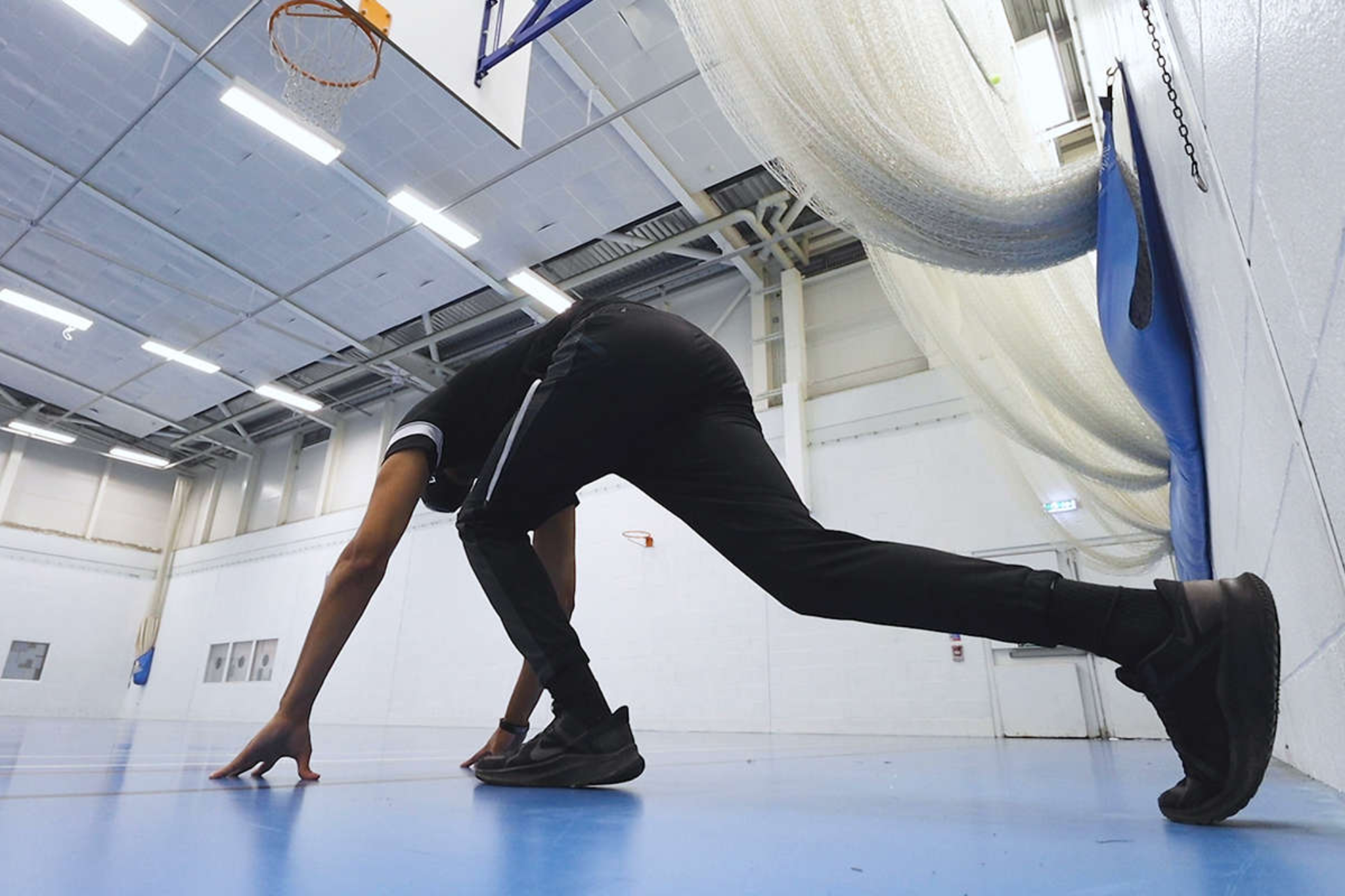 A student is in a sprint start position