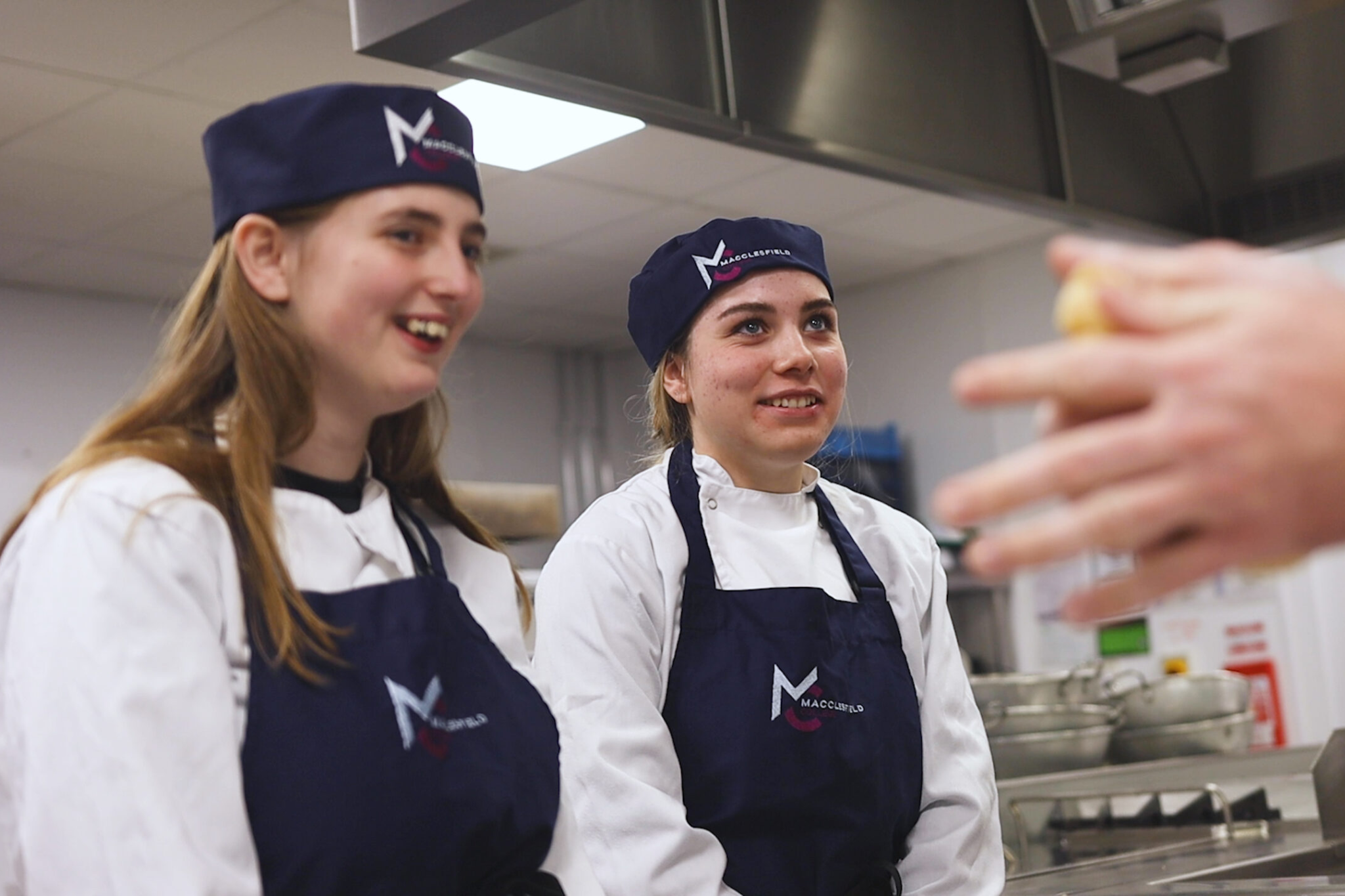 Two Whites Chef Academy students are smiling for a photo.