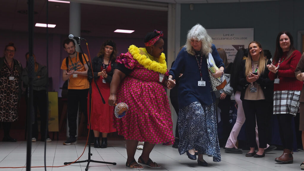 a group of people are dancing