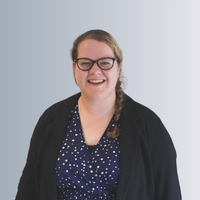a headshot of a female staff member smiling