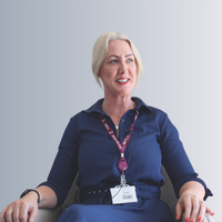 a headshot of a female staff member smiling