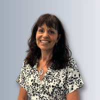 a headshot of a female staff member smiling