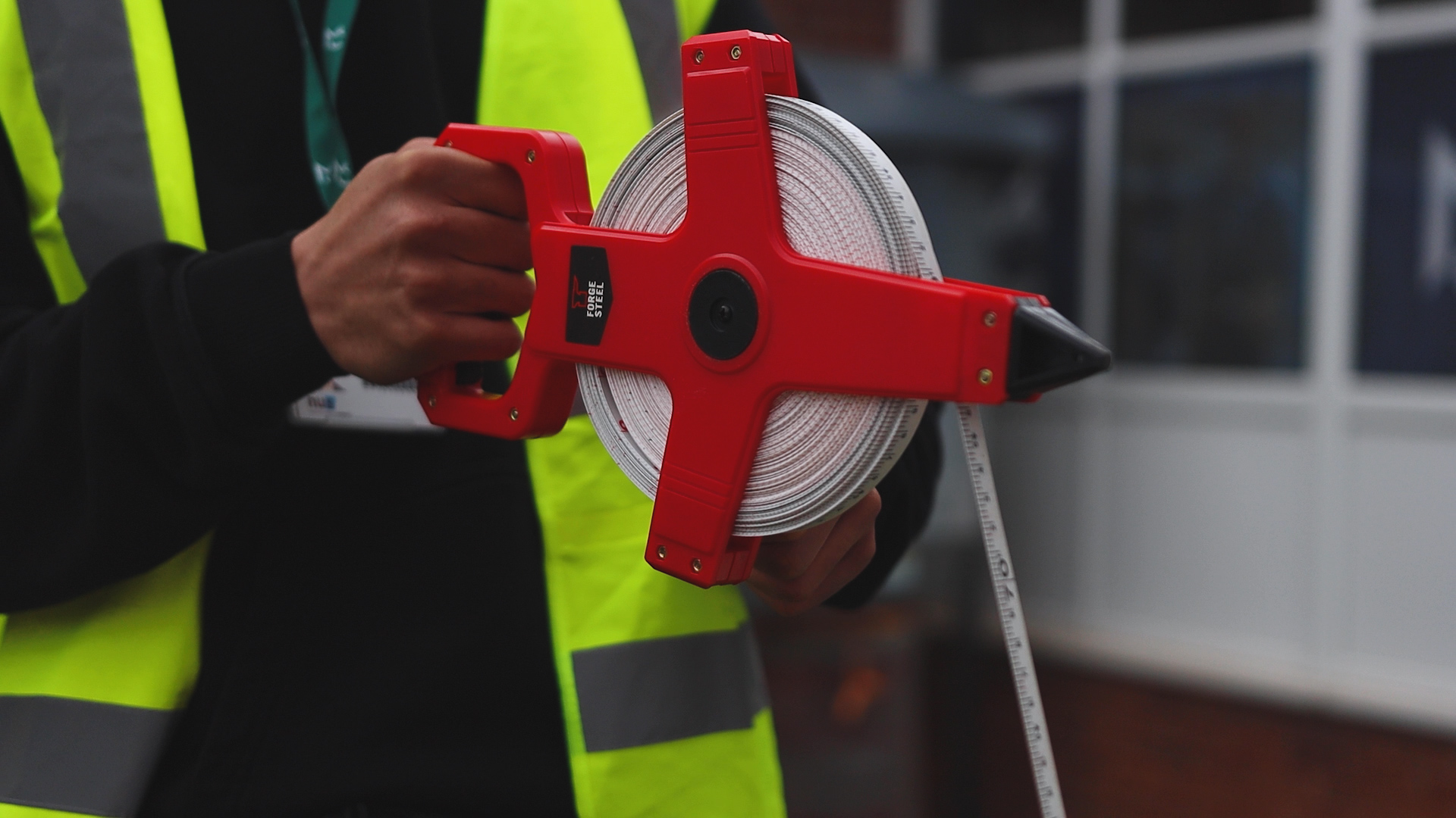 a student is using a tape measure