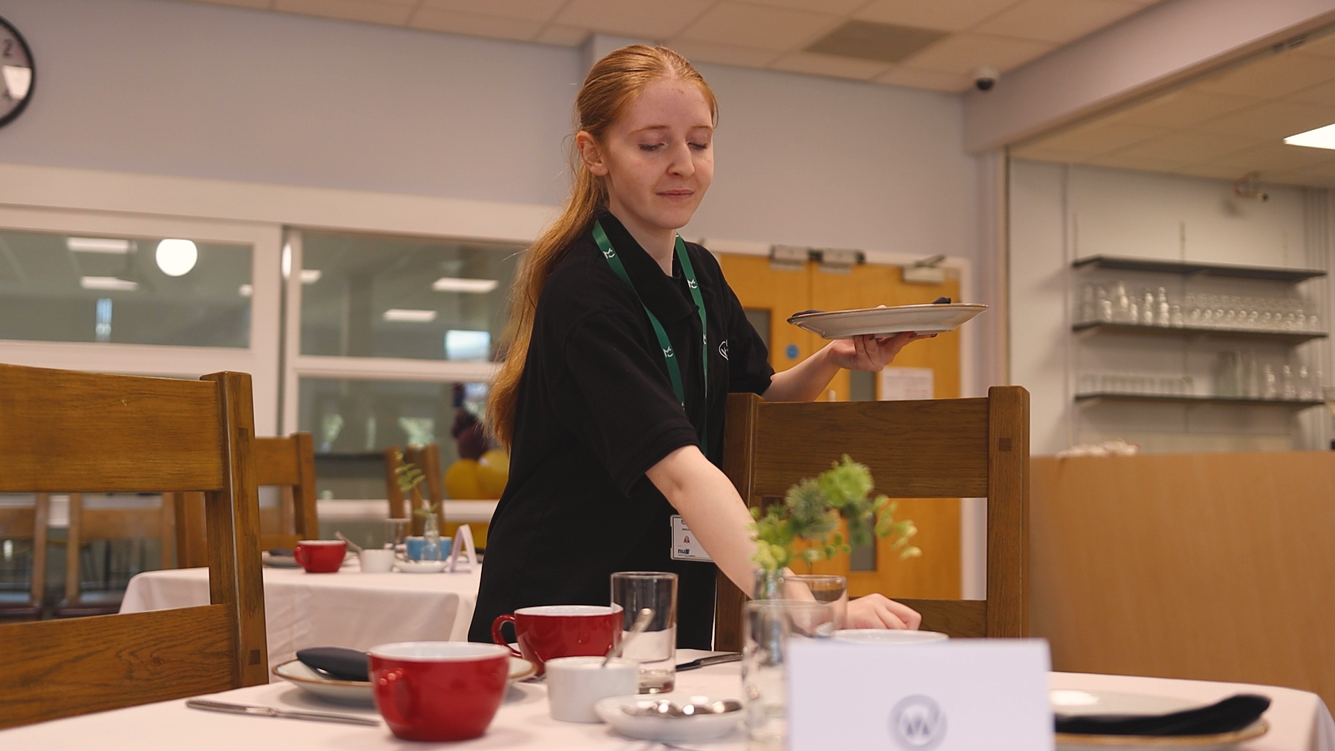 A student is setting a table