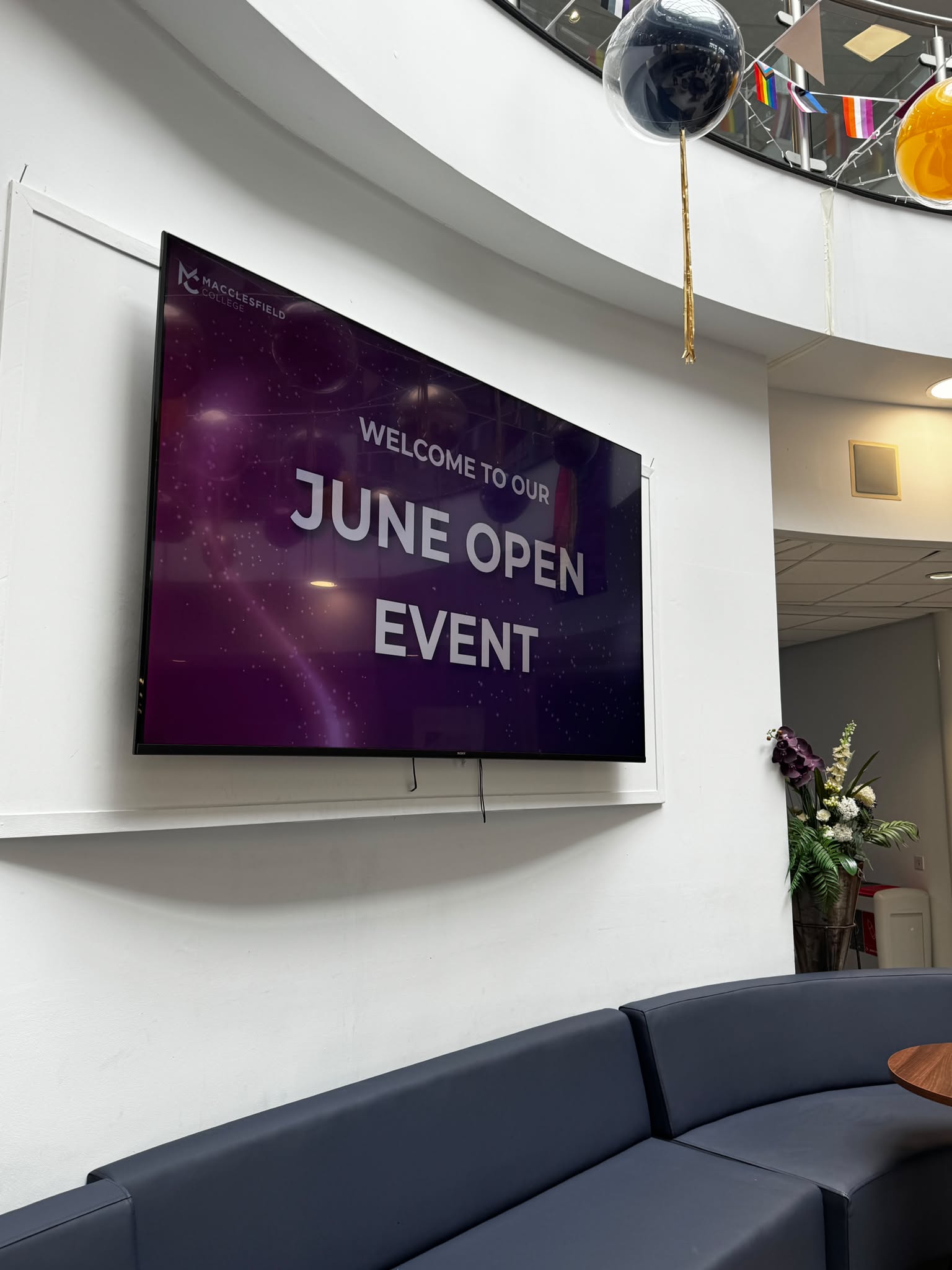 a TV screen has a graphic on it that reads welcome to our June Open Event