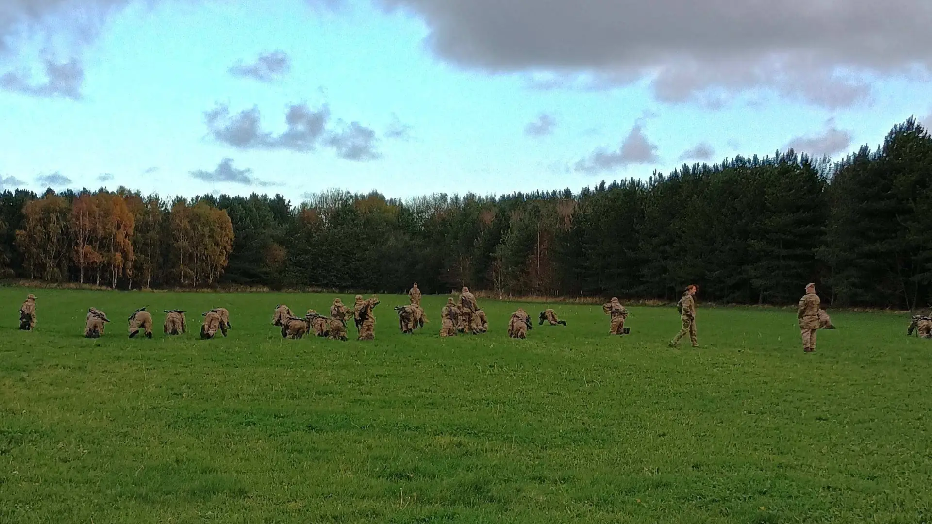 Public Service student dressed in army uniforms on a field