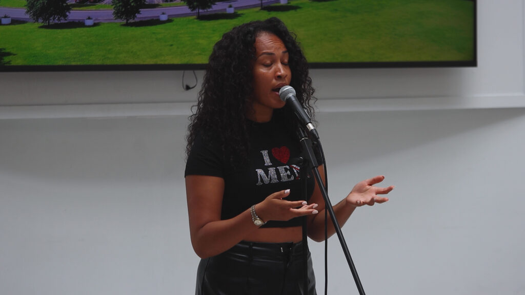 a young female is singing in a microphone