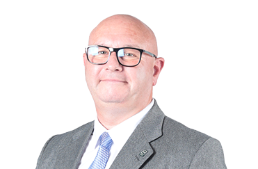 A headshot of a male staff member against a white background