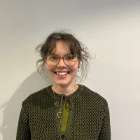 a young female smiles for a photo