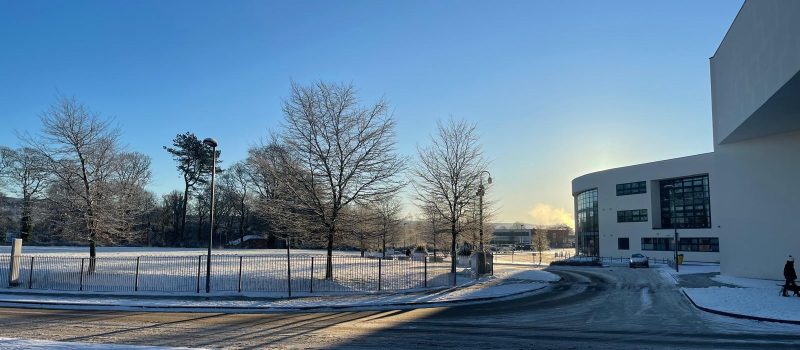 Macclesfield College field with a sunny snowy setting.